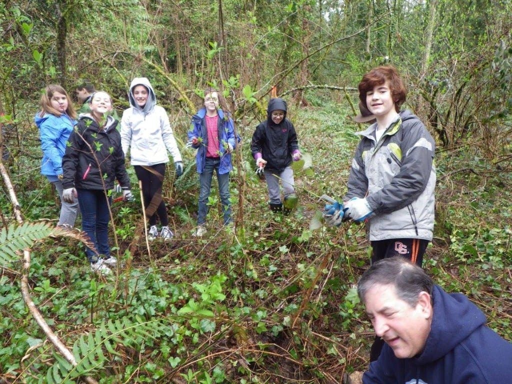 A hardy crew helping pull ivy. A hardy crew helping pull ivy.