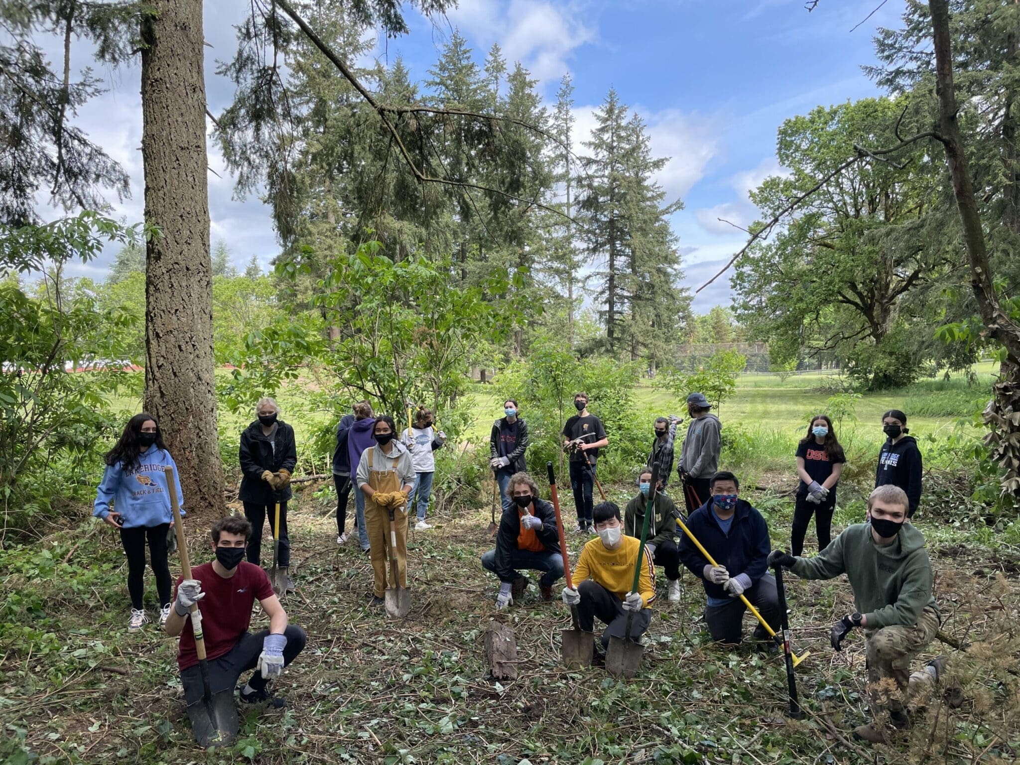 Students pose for a photo after a volunteer event
