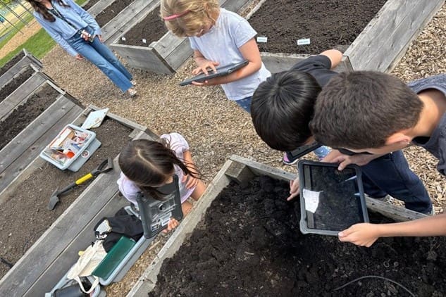 Older students took a more exploratory approach with a scavenger hunt, using iPads to document their discoveries in the school garden.
