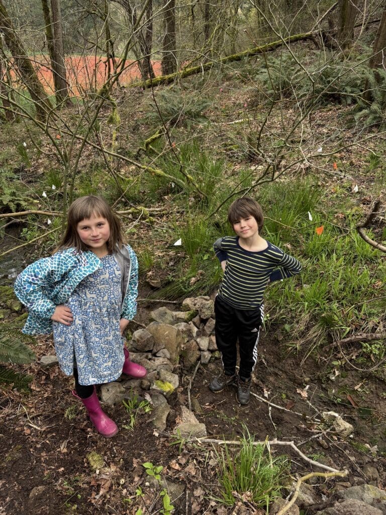 Sammi and Andrew Buck helping build a check-dam on Lily Bay Tributary.